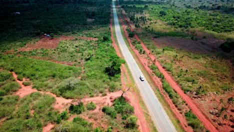 a caravan vehicle traveling on the remote road, uganda in east africa