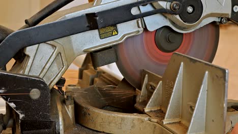 sparks while grinding iron, worker cutting metal with grinder.