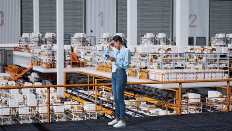 woman in warehouse facing a problem