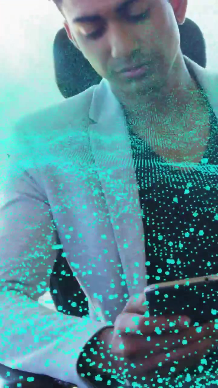 Vertical video: Man tapping smartphone testing turquoise AR overlay and scrolling for business demo