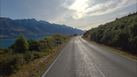 otago, new zealand - cruising along the lakeside road on the way to glenorchy - pov