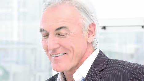 Close-up-of-senior-businessman-smiling