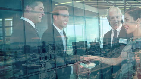 animation of businessman handshake over cityscape