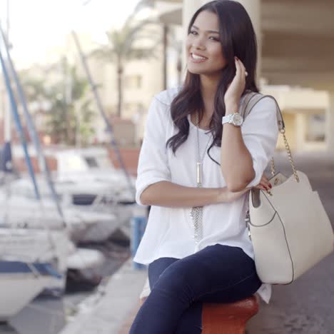 Woman-Relaxing-On-Bench-In-Yacht-Port