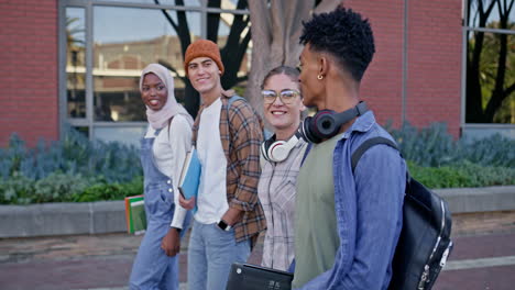 diverse group of students walking on campus
