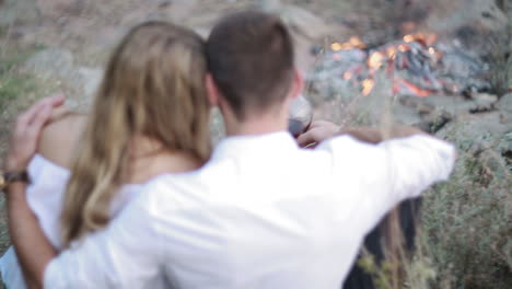 couple drinking wine at nature