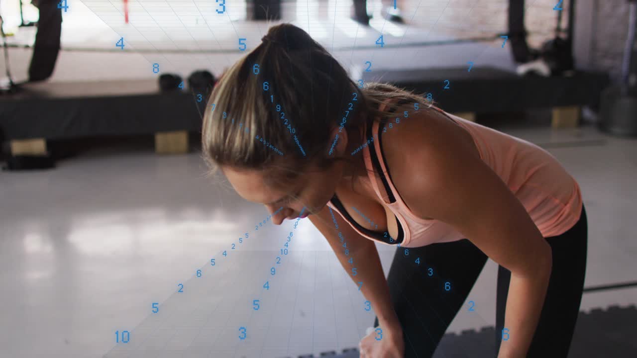 Woman finishing boxing round, bending forward, catching breath while blue overlay aligning head