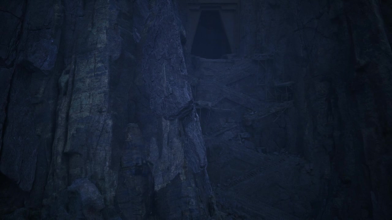 Majestic underground chamber featuring towering pillars and glowing blue light