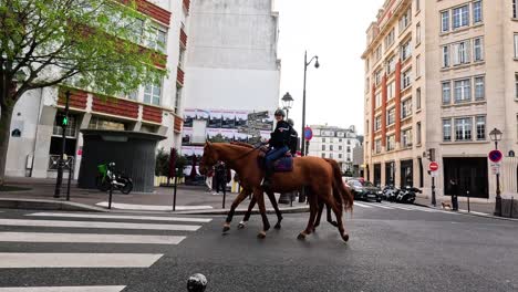 police officer on horseback navigating through city streets