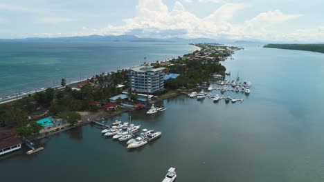 the highway separating the calm river and the sea in puntarenas, costa rica