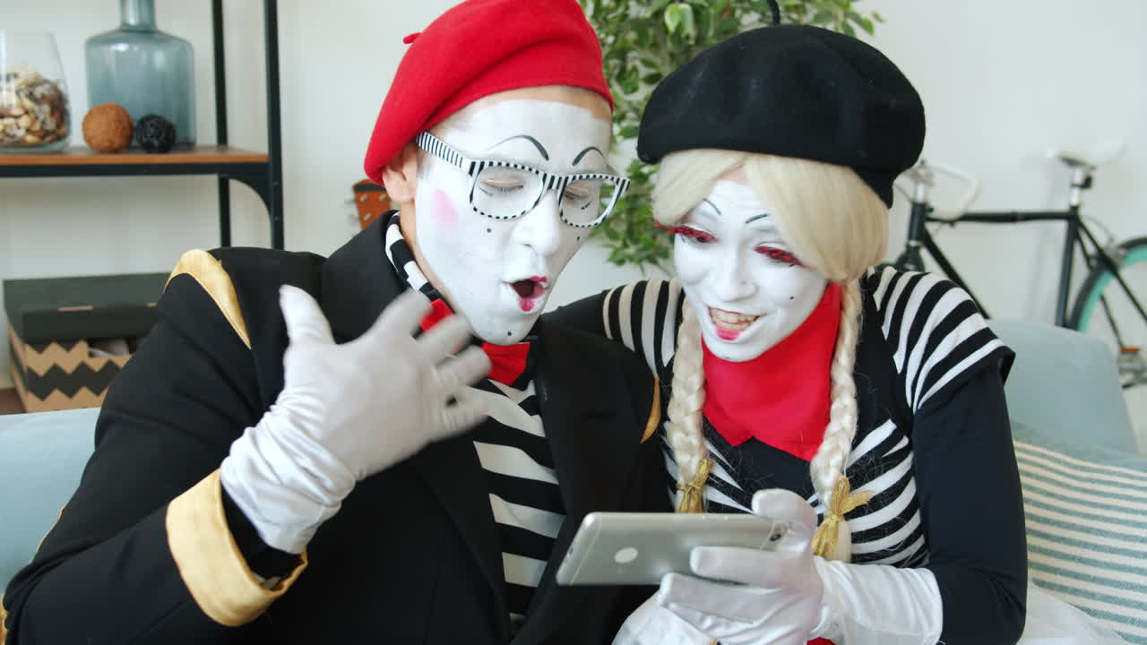 Mime Artists Using a Mobile Phone