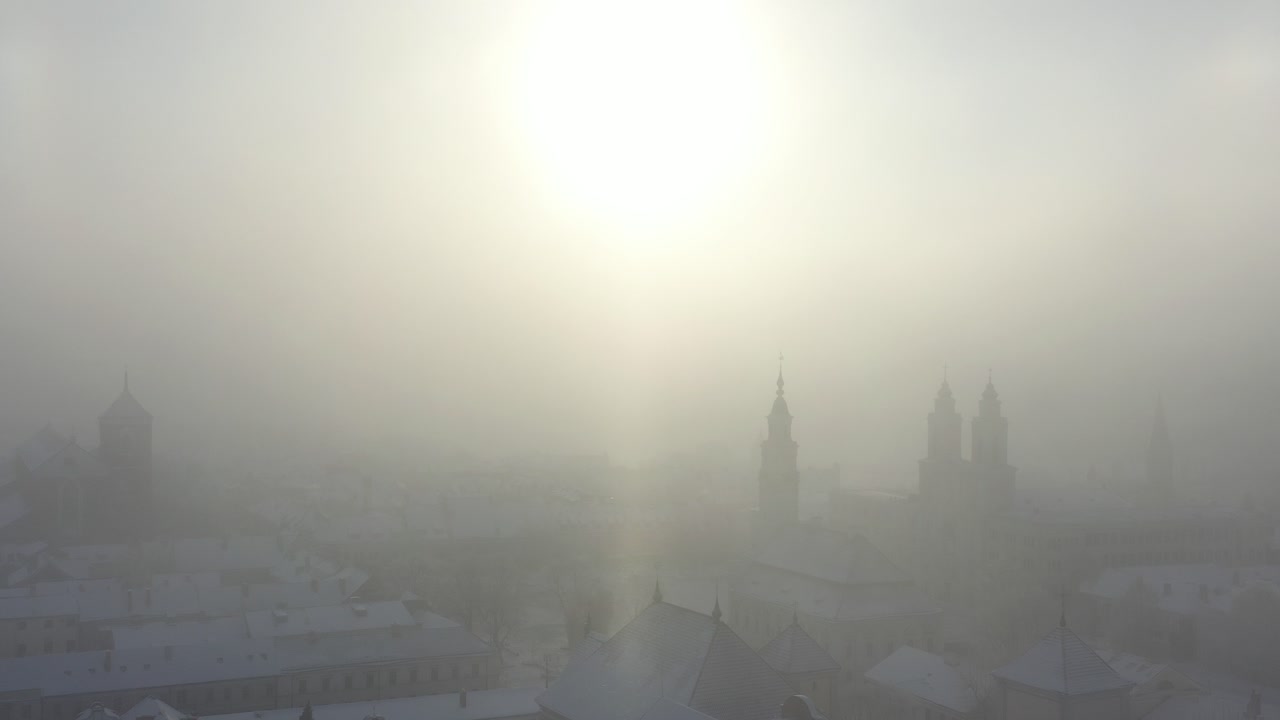 Cold winter sunrise in Kaunas old town. Snow and sun. Lithuania
