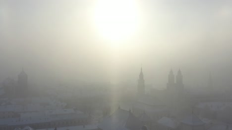 cold winter sunrise in kaunas old town. snow and sun. lithuania