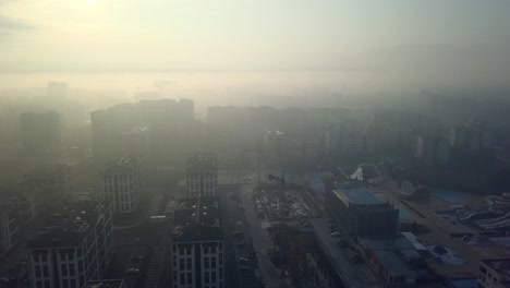 flying over a concrete living apartment area in east europa with many birds flying around the drone