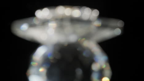 spinning glass jewel blurred making beam lights effects on black
