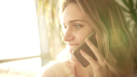 beautiful woman talking phone. portrait of talking woman smile in sun light