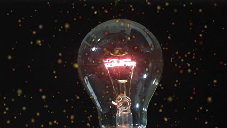 glowing light bulb with particles floating around, energy concept animation