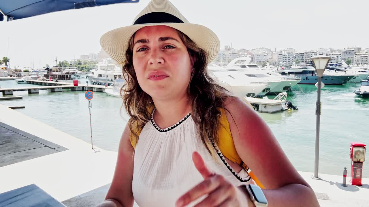 Woman feeling the heat in a port city