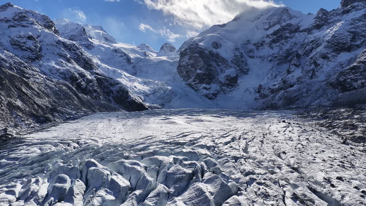 Engadin Switzerland glacier and snowy alps drone view, stunning winter mountain landscape with bright ice textures