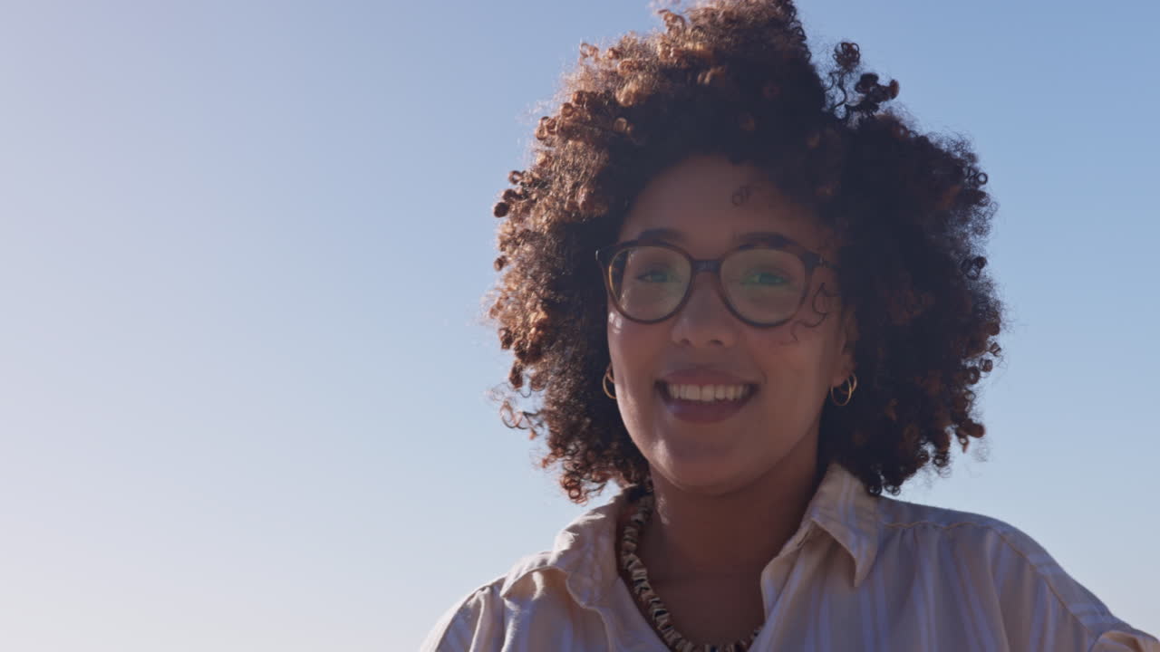 Woman, sky and beach with smile on face