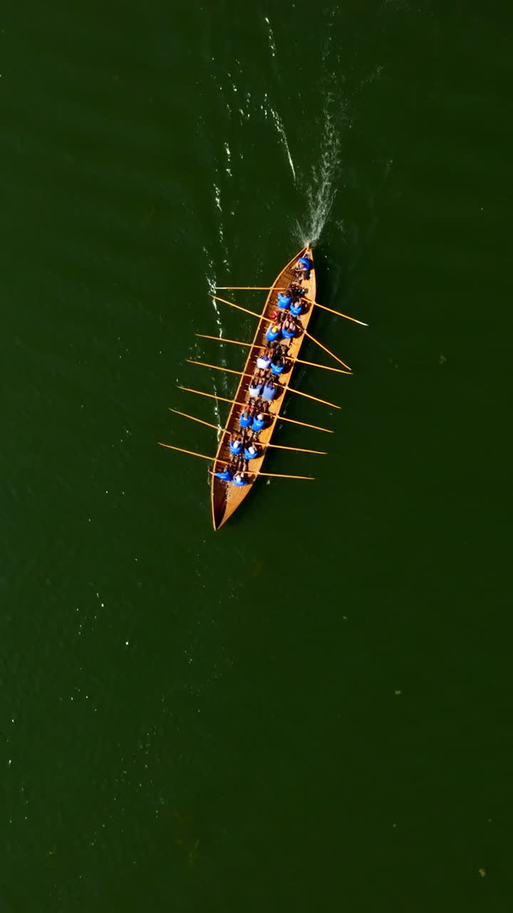 Vertical aerial of a traditional Church Boat (Kirkkovene) rowing in the finnish archipelago