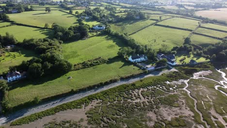 aerial view traeth coch pentraeth farmland meadows countryside with vacation cottages along salt marsh