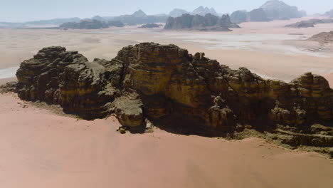 aerial view of mountain ranges in red sand desert of wadi rum in jordan