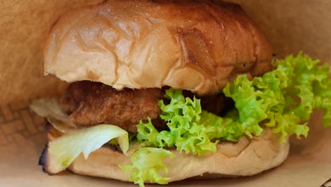 Beef-burger-in-a-take-away-box-on-table