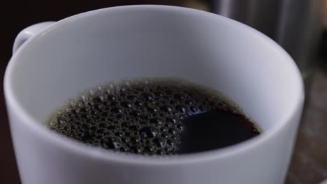 slow motion view of a morning black coffee cup