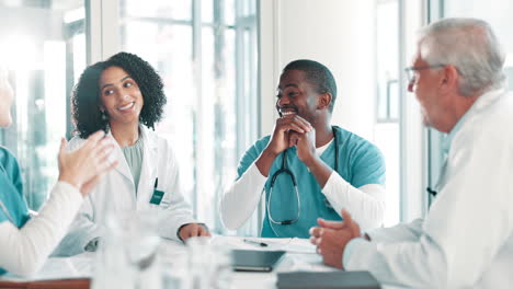 medical team applauding at a meeting