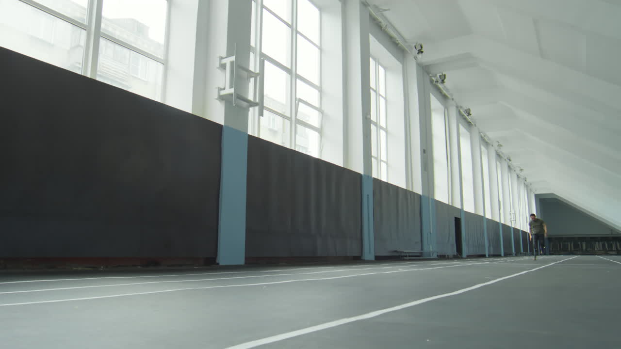 Professional Runner with Prosthetic Leg Training in Stadium