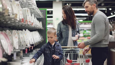 family shopping for dishes at a supermarket