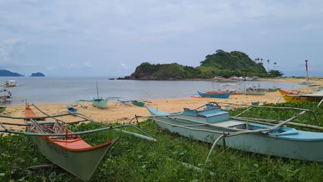 filipino bangka boat on beach of fishing village