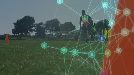 Network-of-connections-and-data-processing-animation-over-people-playing-soccer