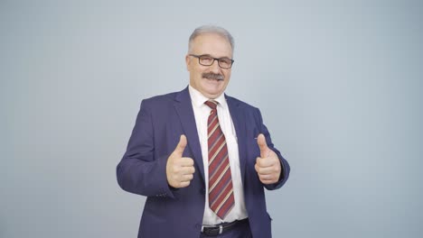 businessman giving positive affirmation looking at camera.