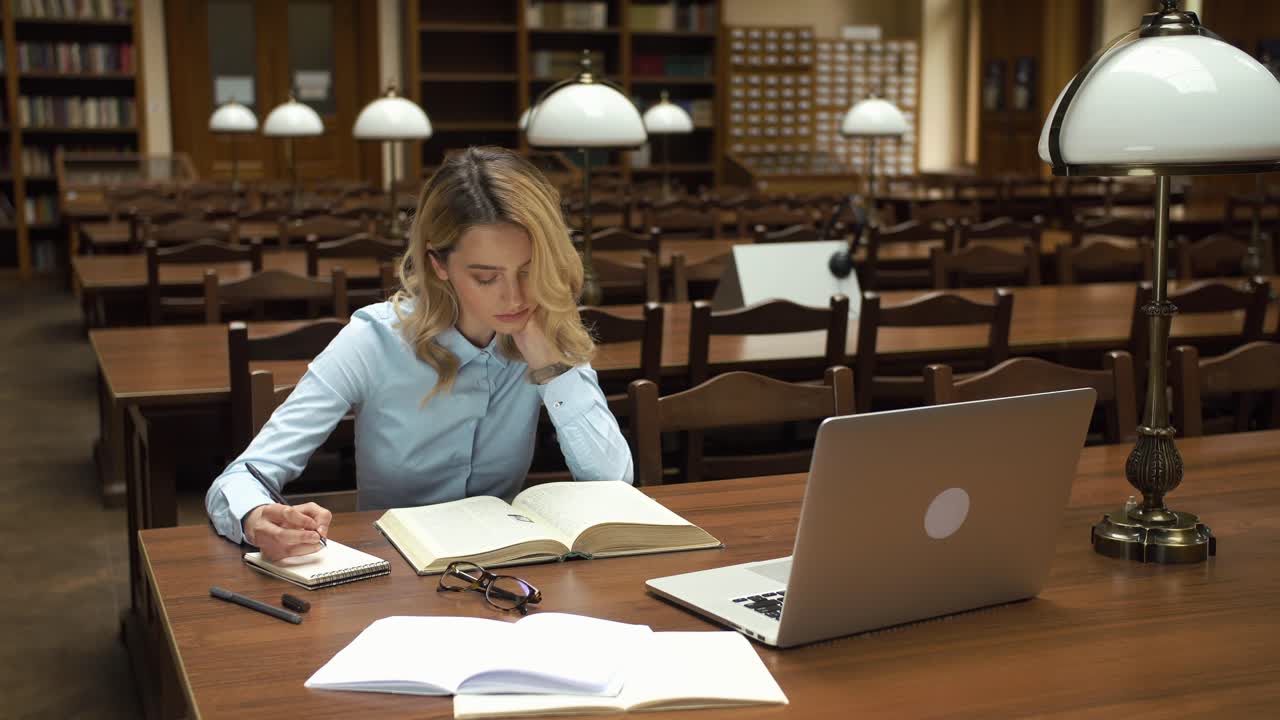 Woman Studying in a Library