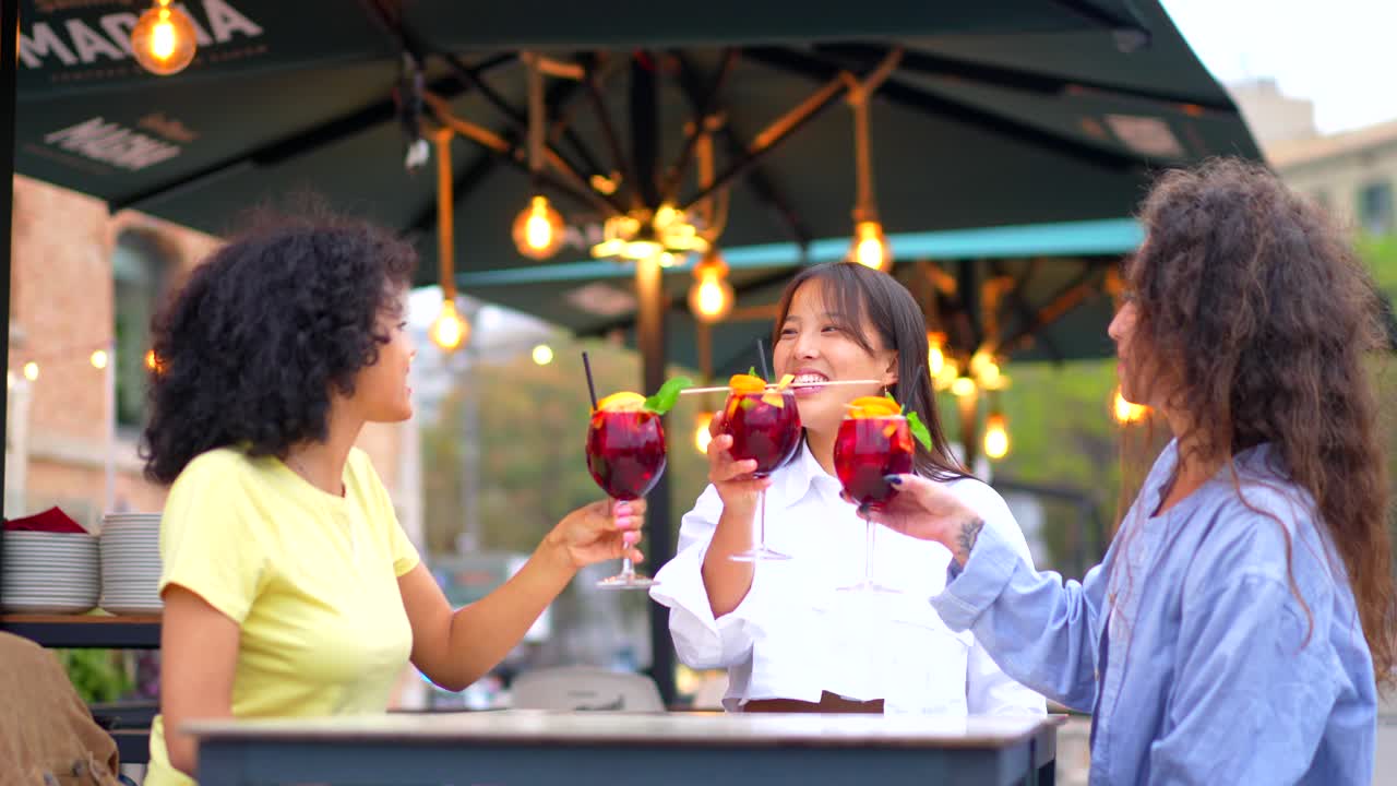 Friends enjoying drinks at an outdoor cafe