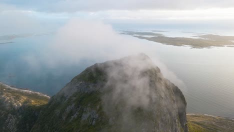 Clouds-Moving-Over-mountain-peaks-and-between-Mountains-With-the-fjord-in-the-background