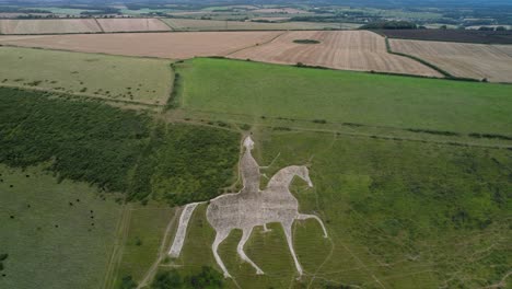 osmington white horse limestone chalk hillside countryside art attraction aerial view pull back reveal