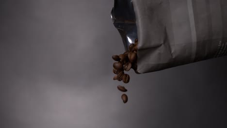 coffee bean falling out of a bag in a coffee machine in super slow motion