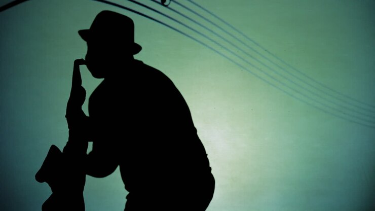 Silhouette of a musician playing saxophone