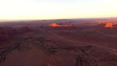 Aerial-panning-shot-over-red-rocks-in-Utah-at-the-Valley-of-the-Gods