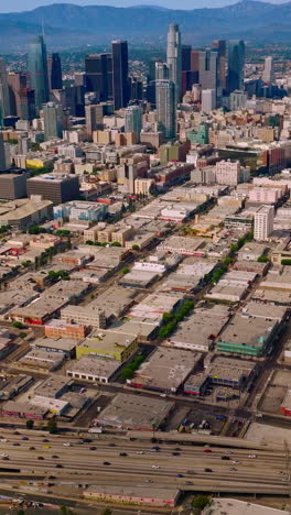 aerial view of american city. los angeles downtown drone shot. vertical video