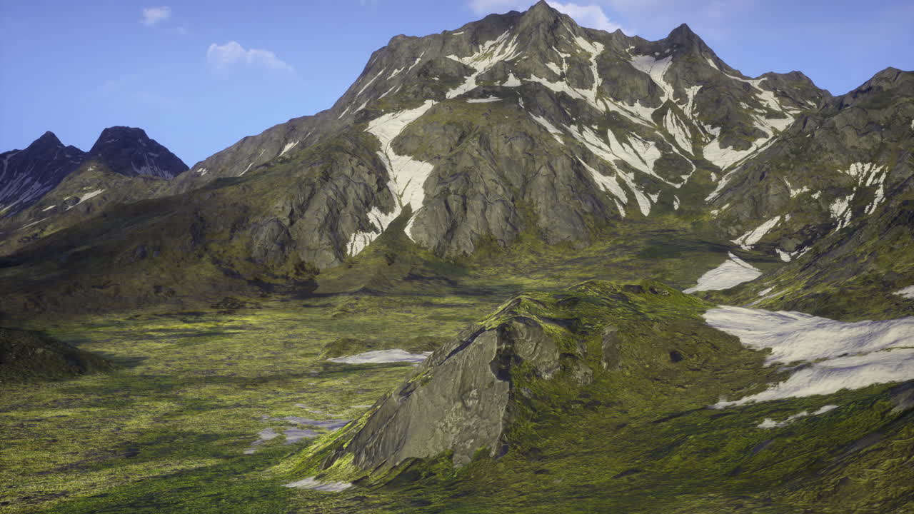 Scenic view of rugged mountains and lush valleys under clear blue skies
