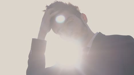 handsome-man-wearing-office-suit-at-back-light-slow-motion