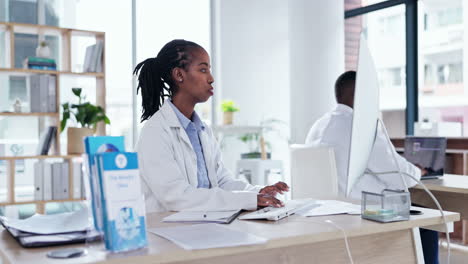 Computer,-typing-and-black-woman-doctor