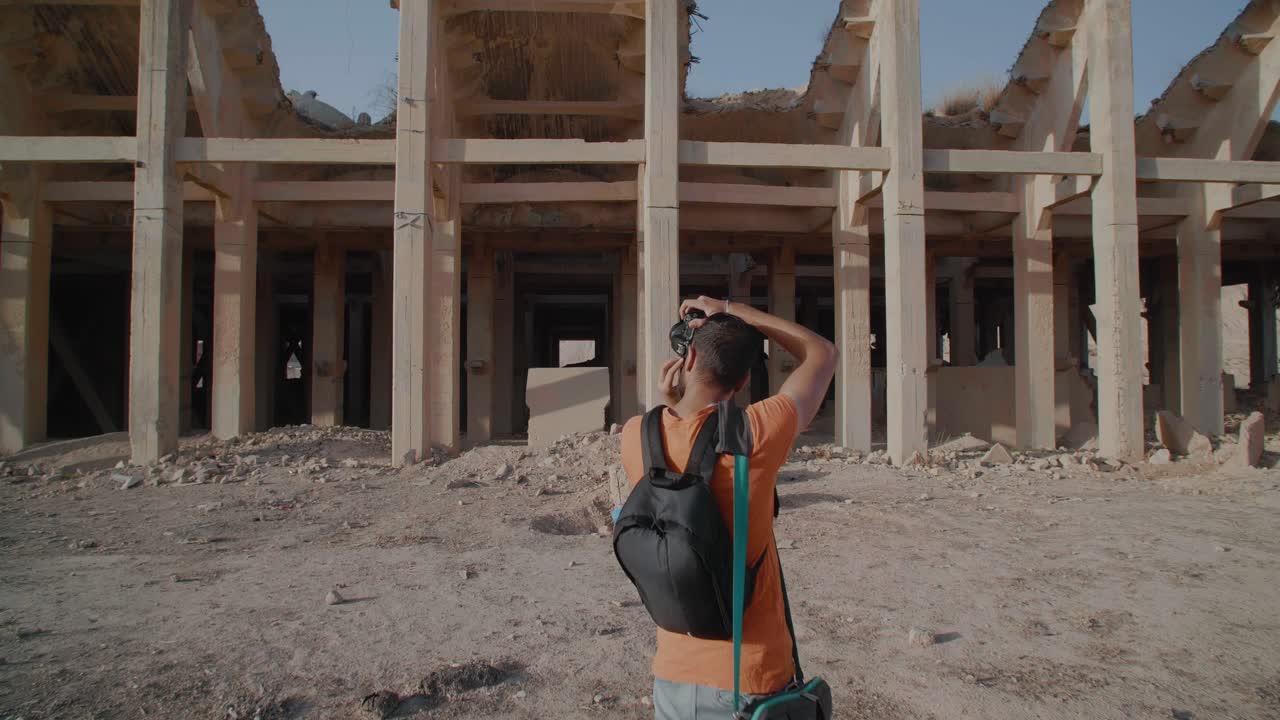 A photographer taking pictures of an abandoned place