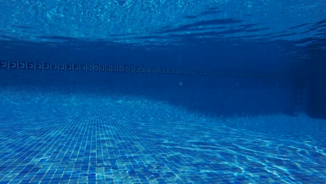 swimming pool underwater, blue water background