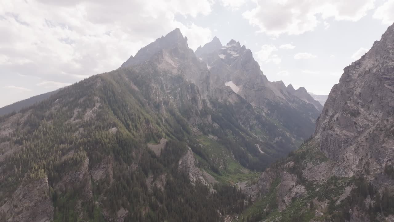 Drone shot of the Teton mountain range at sunset in Montana