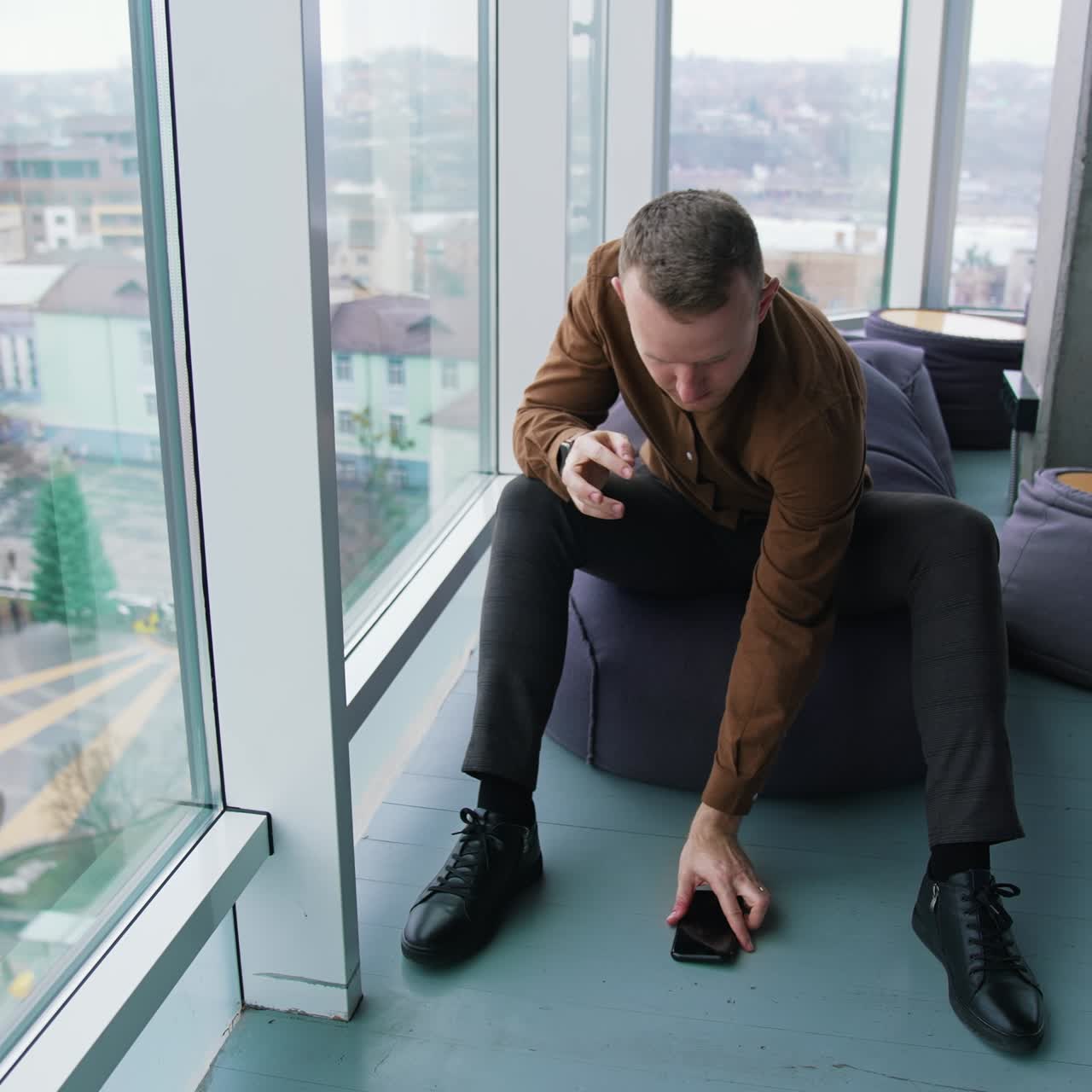 Young man using mobile phone. Work stress concept of man